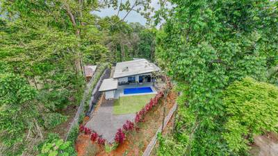 Jungle-Immersed Modern Retreat with Riverfront, Pool, and Expansion Potential in Cinco Ventanas image 2