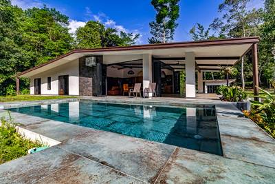 Exceptional 12-Acre Investment Property in Central Ojochal – Riverfront Jungle Estate with Home, Cabin, Workshop & Endless Development Potential image 1