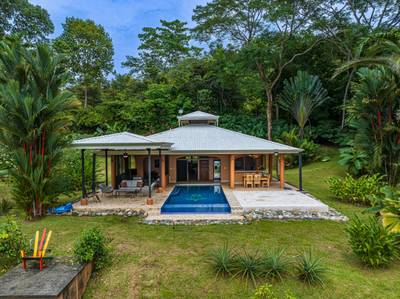 2-Bedroom Jungle Home with Window Ocean Views, Infinity Pool, and Strong Rental Potential in Matapalo image 1
