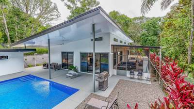 Jungle-Immersed Modern Retreat with Riverfront, Pool, and Expansion Potential in Cinco Ventanas image 3