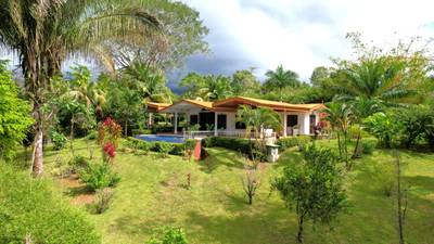 Charming 3 Bedroom Home with Lush Garden Acreage and Pocket Ocean View image 1